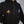 Black hoodie with gold fleur-de-lis design and blue patch on a mannequin against a white background