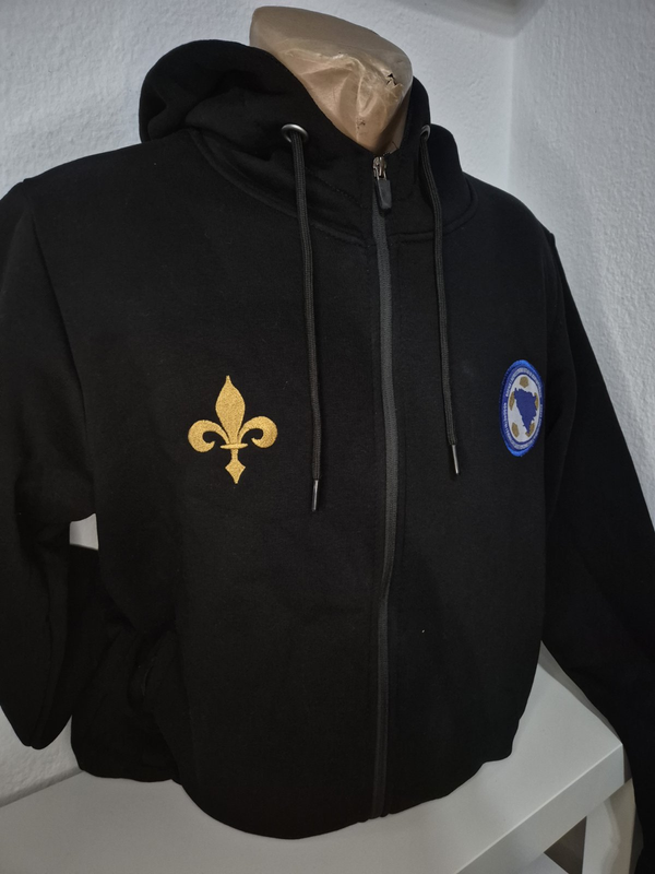 Black hoodie with gold fleur-de-lis design and blue patch on a mannequin against a white background